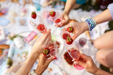 Hands With Glasses Cheers On Summer Day Picnic Stock Image