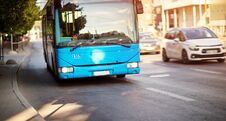 Bus Moving On The Road In City In Early Morning Royalty Free Stock Photo