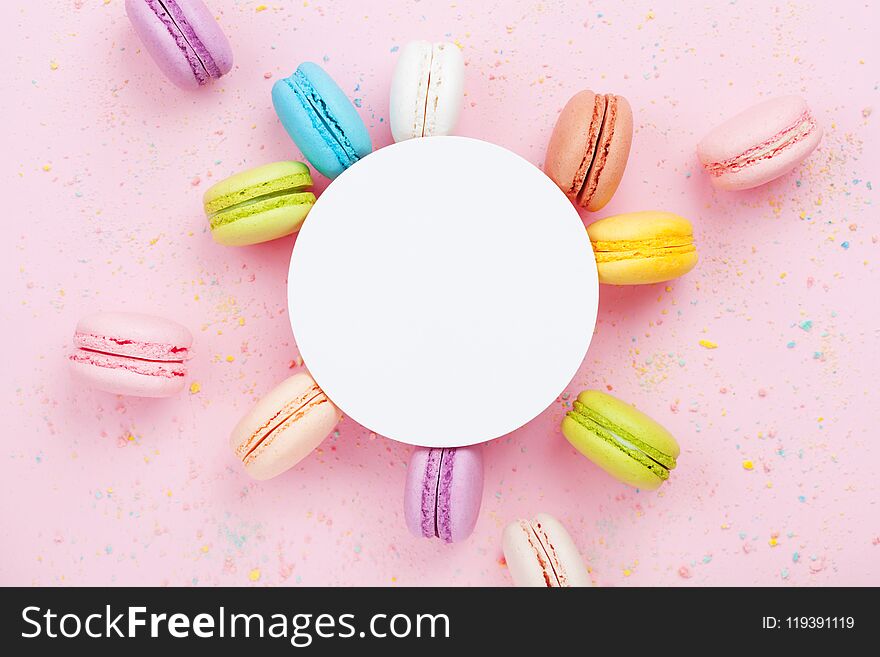 Creative Mockup With Colorful Macaron Or Macaroon On Pink Pastel Background Top View. Flat Lay Composition.