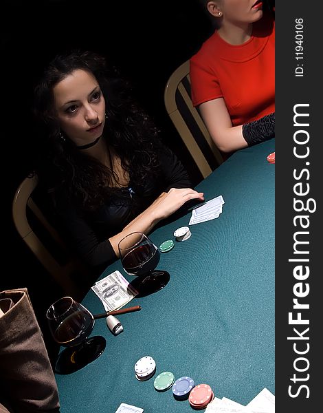 Attractive girls playing poker