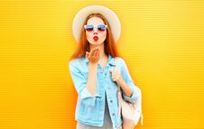 Stylish Cool Girl Sends An Air Kiss On Orange Royalty Free Stock Image