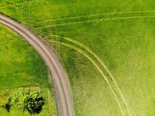 View From Above On Field With A Road In Russia Royalty Free Stock Image