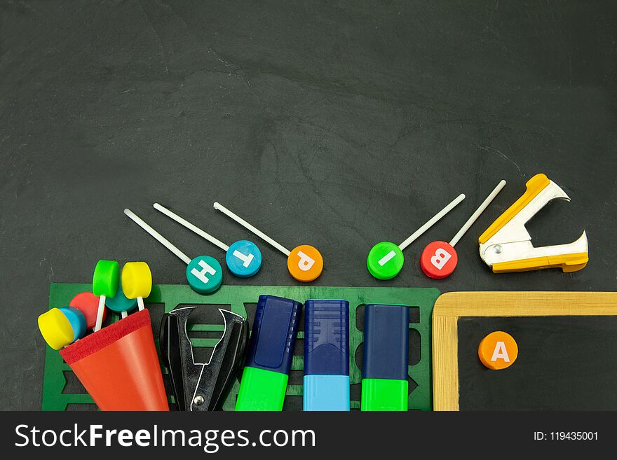 Closeup Of Colorful School Supplies With Copy Space On Blackboard Background. Back To School.