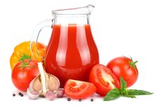 Tomato Juice In Glass Jug With Tomato, Garlic, Spices, And Basil Isolated On White Background Royalty Free Stock Photo