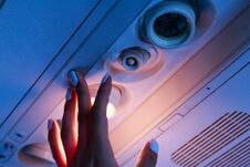 The Passanger Hand Closeup Turn On The Light In The Airplane Stock Images