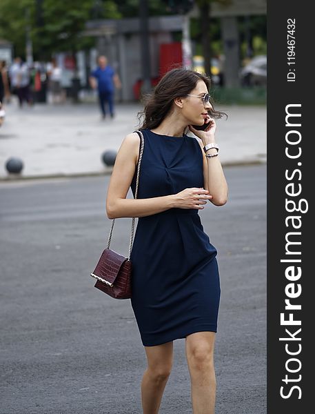 Woman Wearing Black Sleeveless Bodycon Mini Dress