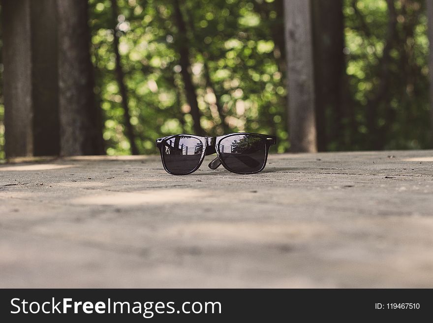 Shallow Focus Photography Of Black Sunglasses