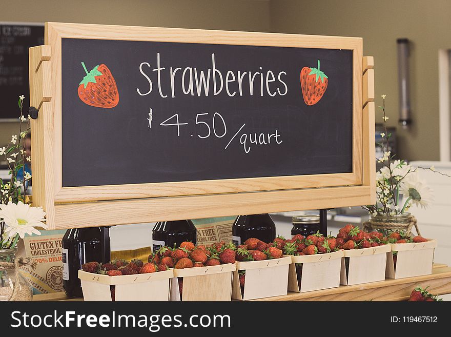 Strawberries for 4.50 Per Quartz Signage Above Bunch of Strawberries