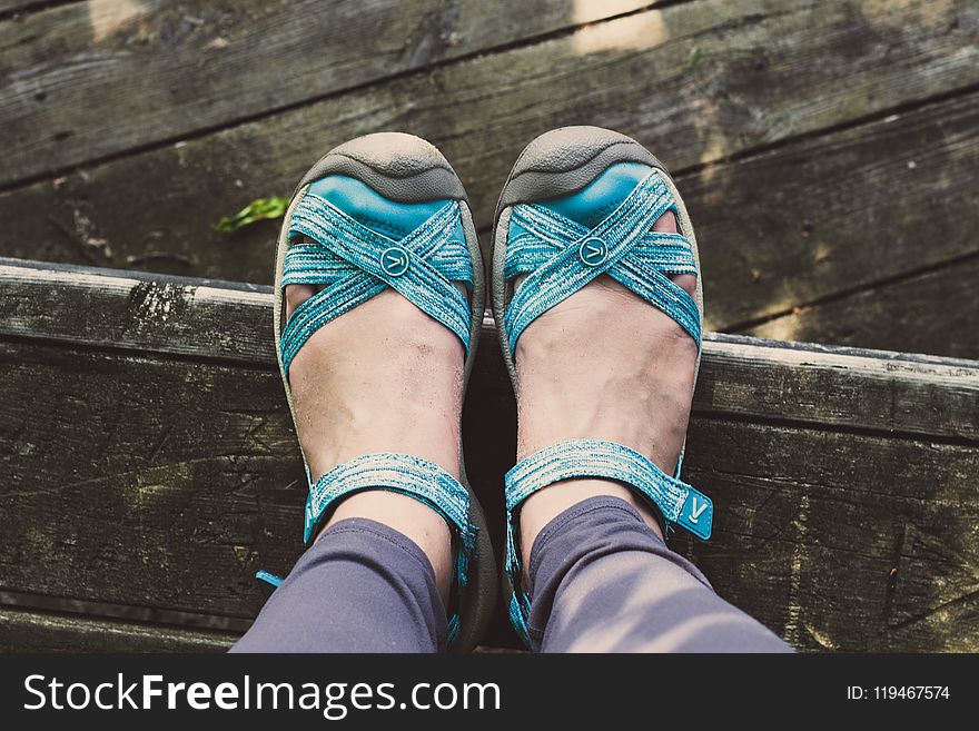 Person Wearing Pair of Blue Leather Sandals