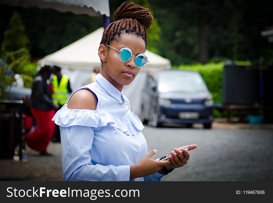 Selective Focus Photo of Woman Holding Android Smartphone