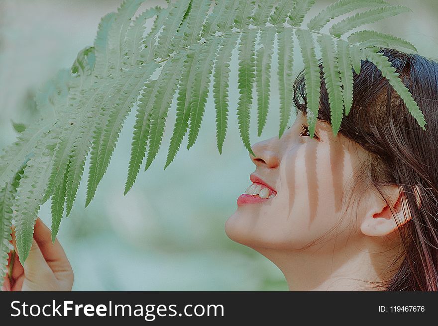 Woman Holding Leaves