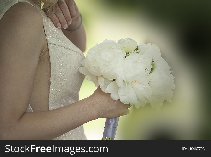 Woman Holding White Flower Bouquet
