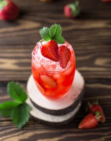 Fresh Strawberry Cocktail. Fresh Summer Cocktail With Strawberry And Ice Cubes. Glass Of Strawberry Soda Drink On Dark Background. Stock Image