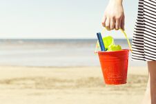 Woman Holding Bucket With Children`s Beach Toys - Spade And Shovel On A Sunny Day Stock Photos
