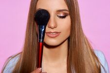 Woman With Makeup Brush Royalty Free Stock Photography