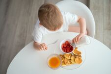 The Child Has Breakfast On A Sunny Morning Stock Photography