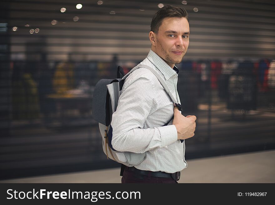 Portrait Of Handsome Man Fashion Hairstyle Holds Bag