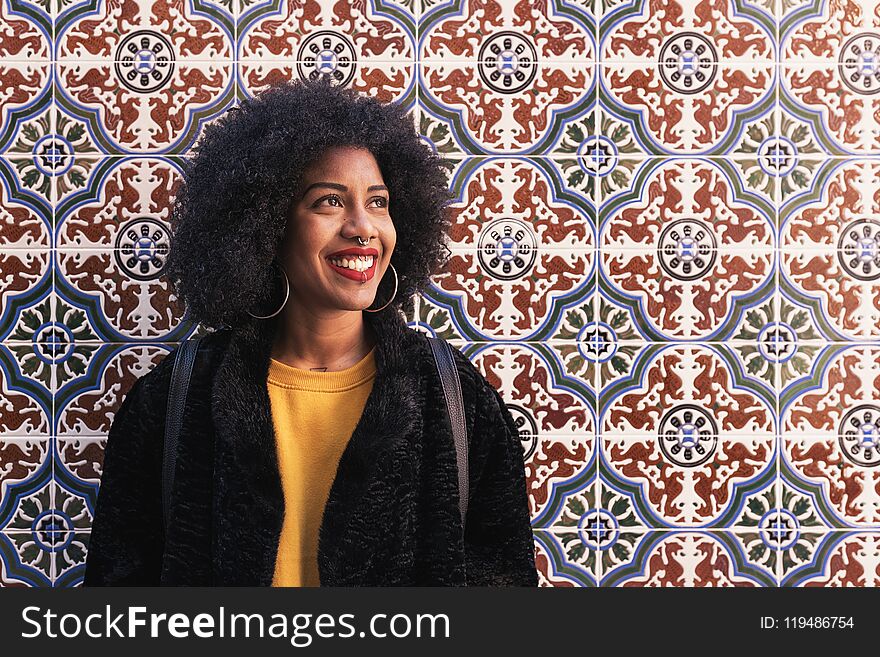 Portrait of beautiful afro american woman in the street. Portrait of beautiful afro american woman in the street.