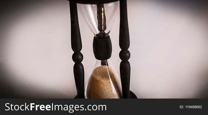 Hourglass on dark background.the concept of time