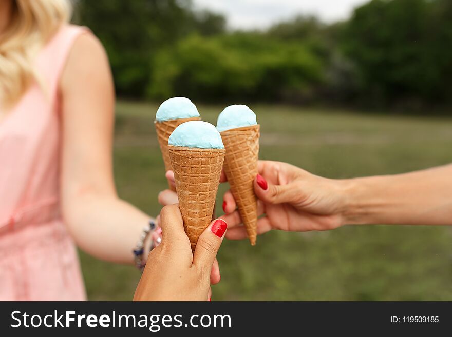 Girl hold icecream cone in hand