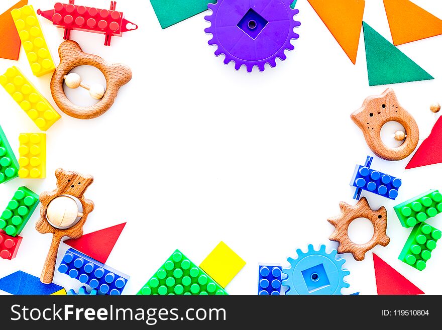 Colored construction toys mockup on white background top view. Colored construction toys mockup on white background top view.