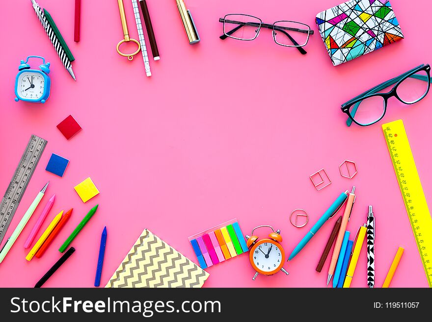 Education background, mockup. School, student, office supplies. Stationery, glasses, alarm clock, notebook on pink