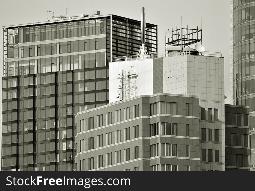 Facade fragment of a modern office building. Exterior of glass wall with abstract texture. Black and white. Facade fragment of a modern office building. Exterior of glass wall with abstract texture. Black and white.