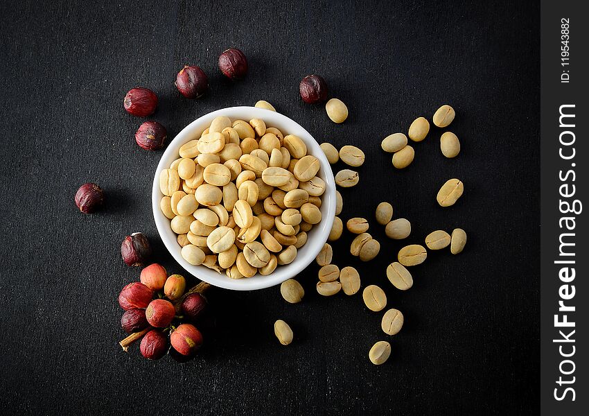 Coffee Seeds On Black Wooden Background