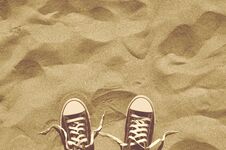 Unlaced Sneakers On Beach, Retro Style Photo, Top View Stock Images