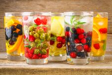 Various Detox Water In Glasses, Different Tastes, Berries, Fruits. Royalty Free Stock Photo