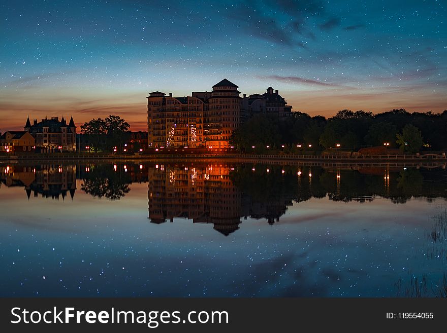 Landscape Photo Of Building Near Body Of Water