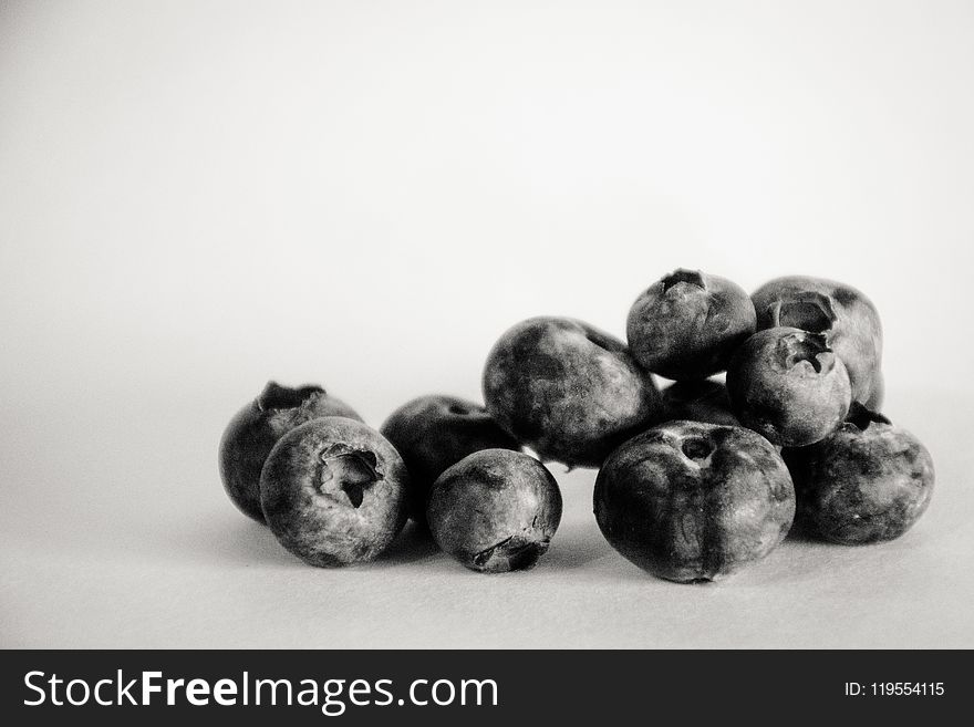 Grayscale Photography Of Blueberries