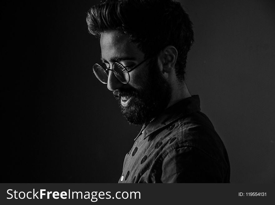 Grayscale Photography Of Man Wearing Round Eyeglasses