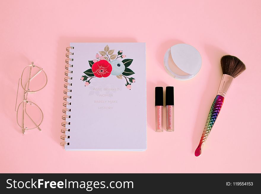 Flat Lay Photography Of Notebook Near Eyeglasses And Make-up