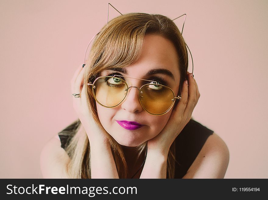 Woman Wearing Sunglasses And Alice Band