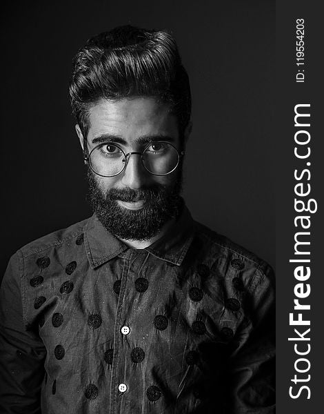 Grayscale Photography Of Man Wearing Eyeglasses