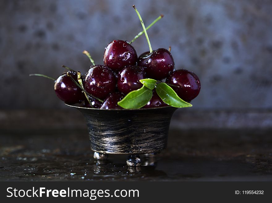 Red Cherries on Stainless Steel Bowl