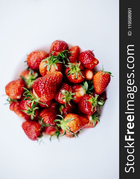 Strawberries In A Plate Isolated.