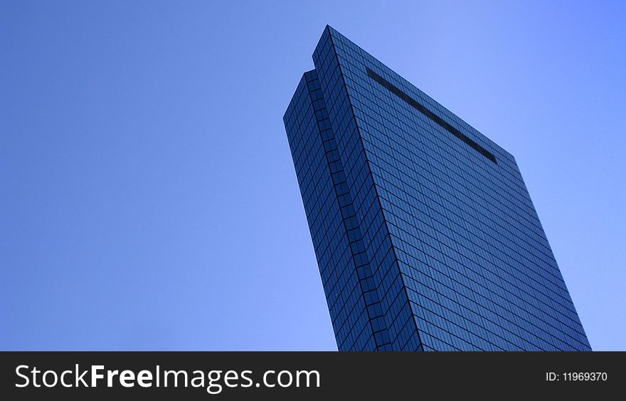 Wide angle view of John Hancock tower with blue sky background, Boston, Massachusetts, U.S.A.