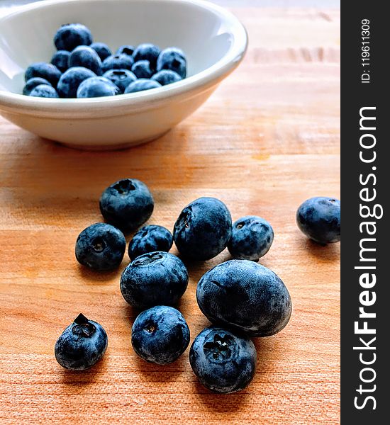 Blackberries On Brown Surface And Bowl