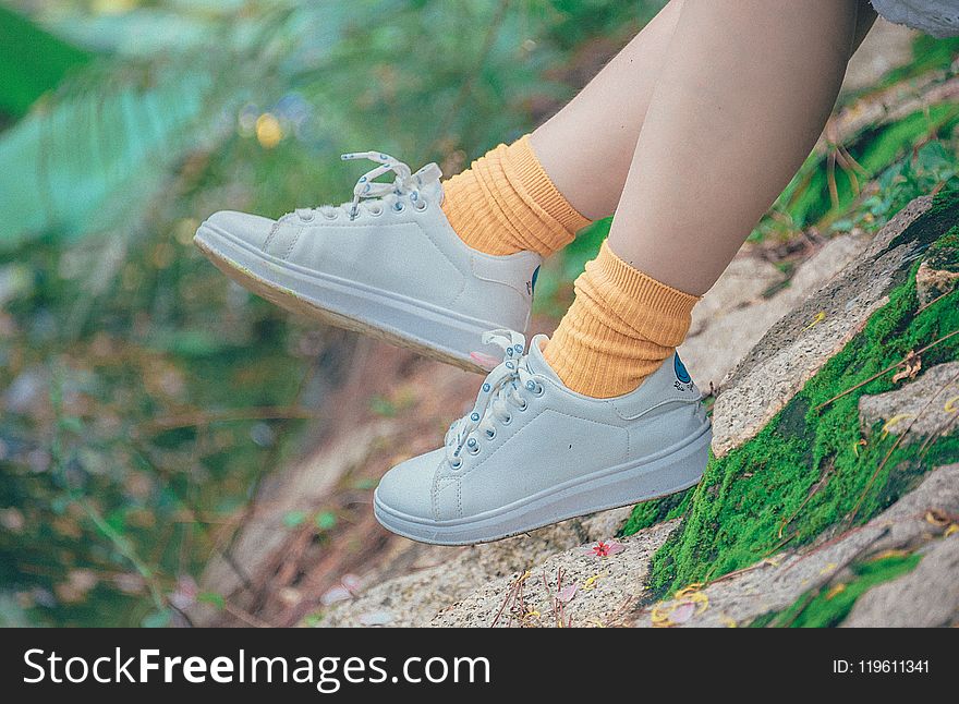 Person Wearing White Plimsoll Shoes
