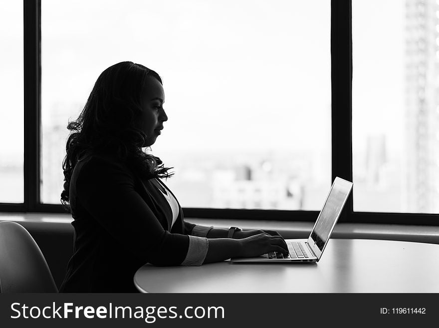 Grayscale Photography of Woman Using Laptop