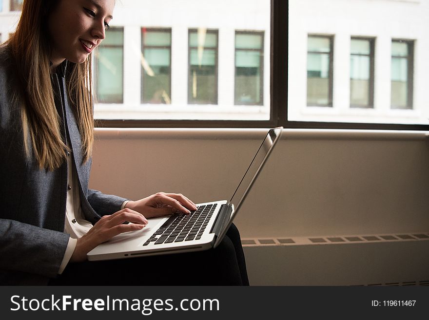 Photography Of Woman Using Laptop