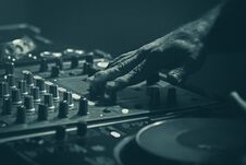 Disk Jockey Mixer, Stage Equipment DJ Mixing With The Hand Royalty Free Stock Images