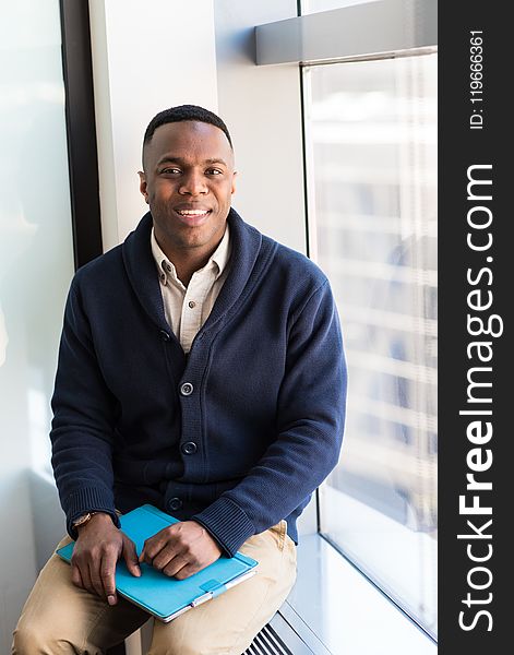 Man Wearing Blue Button-up Sweater