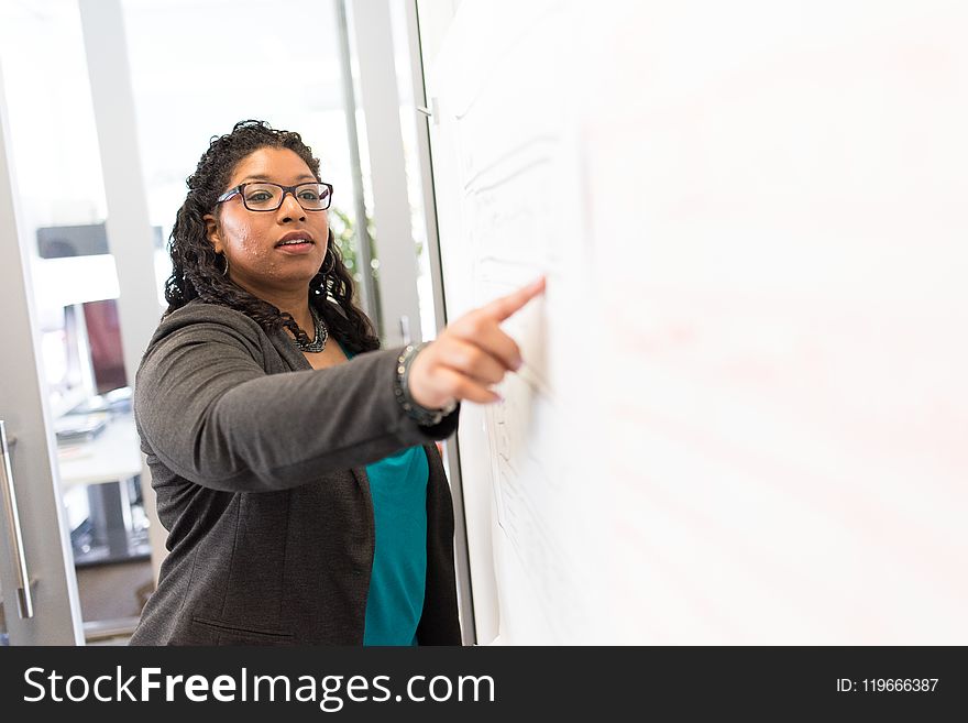 Woman Beside Whiteboard