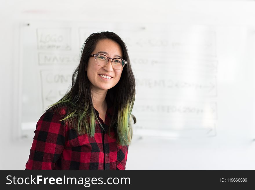 Woman Standing in Front of Whiteboard