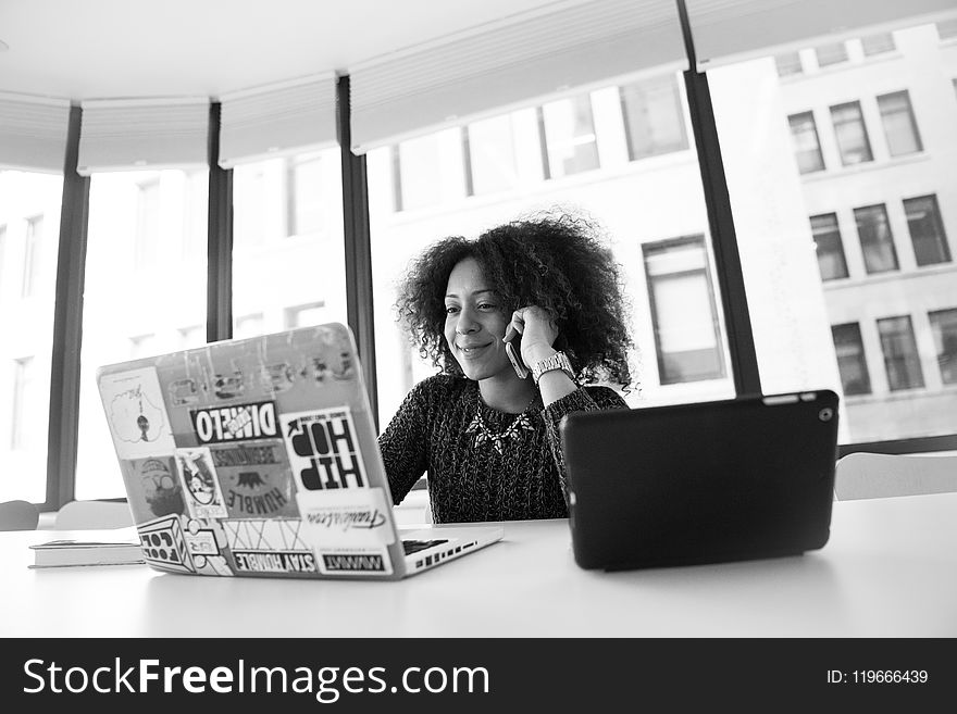 Grayscale Photo Of Woman Using Laptop