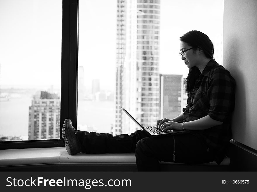 Grayscale Photo Of Woman Wearing Eyeglasses