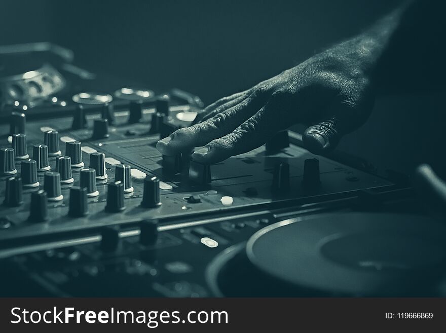 Disk Jockey mixer, stage equipment DJ mixing with the hand